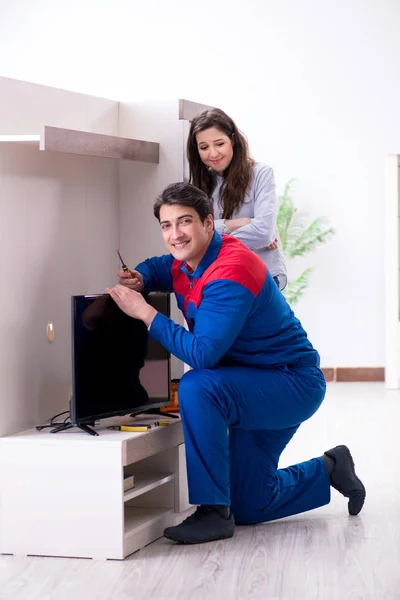 depositphotos 199148904 stock photo tv repairman technician repairing tv